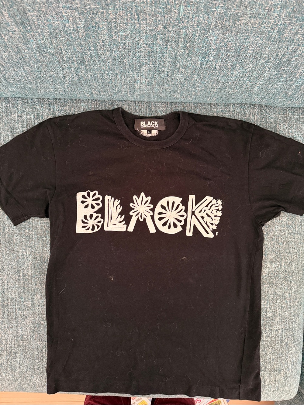 Comme des Garcons BLACK Graphic Black T-Shirt with White Floral Logo